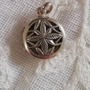Cute Sterling silver locket pendant with engraved detail.