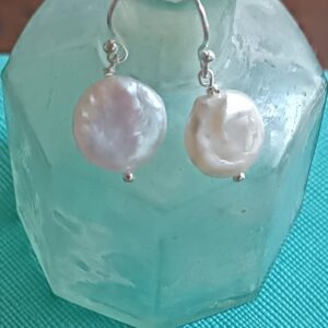 Cream Coin pearl earrings with silver hooks.