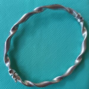 Sterling silver bangle with safety clasp
